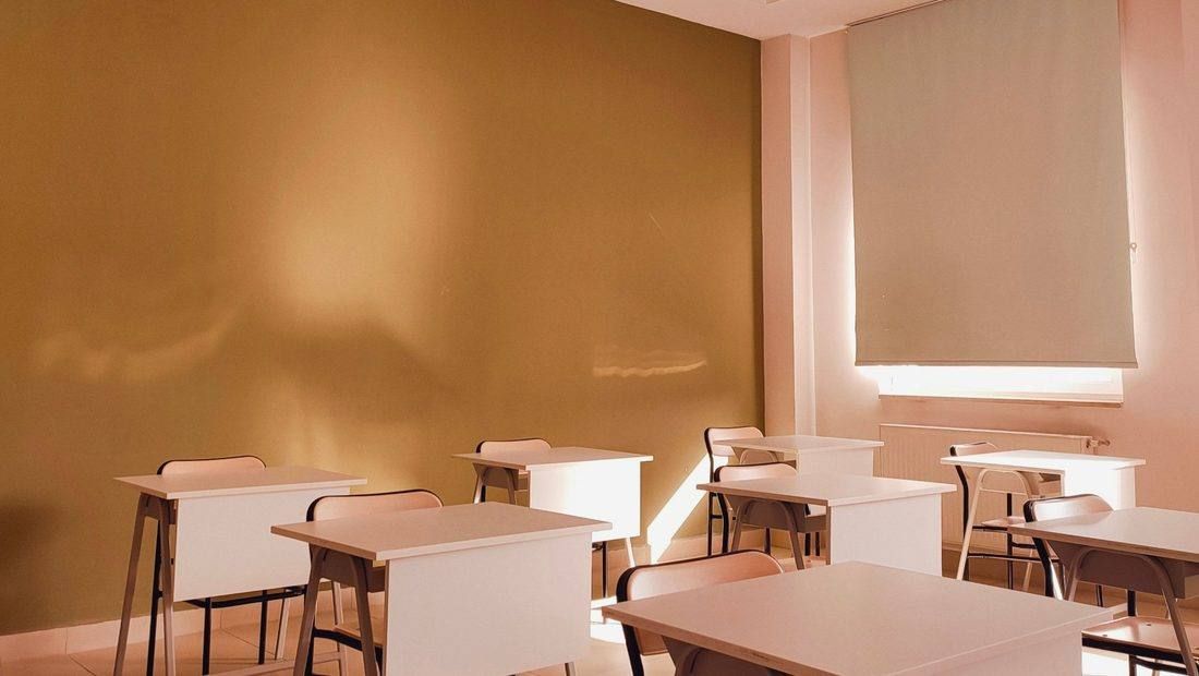 Bright, tidy classroom with desks