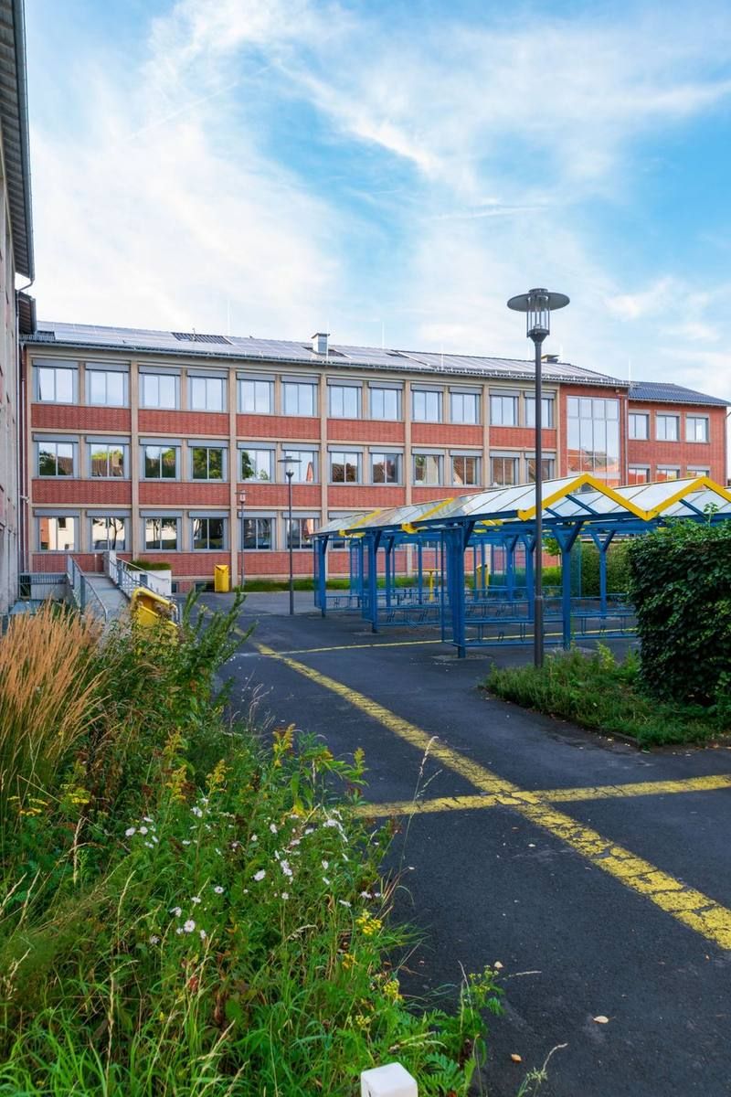Red-brick school building and courtyard