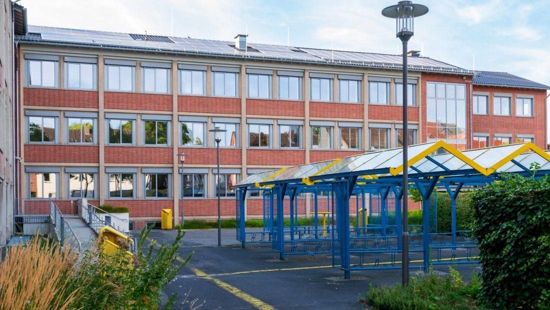 Red-brick school building and courtyard